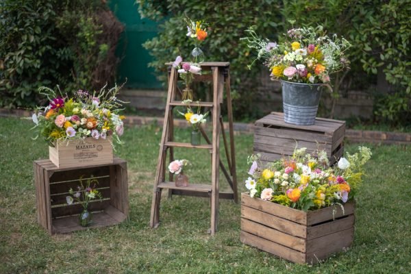 Vintage objects for wedding decor. Vases, vintage ladder, wooden crates.